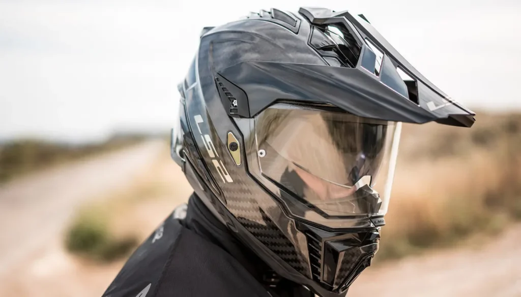 The LS2 Explorer Carbon exists to answer a single question: how affordably can you put a rider in a carbon shell with ECE 22.06 certification? The answer in 2025 is $399, and the result is a compelling if unpolished package.